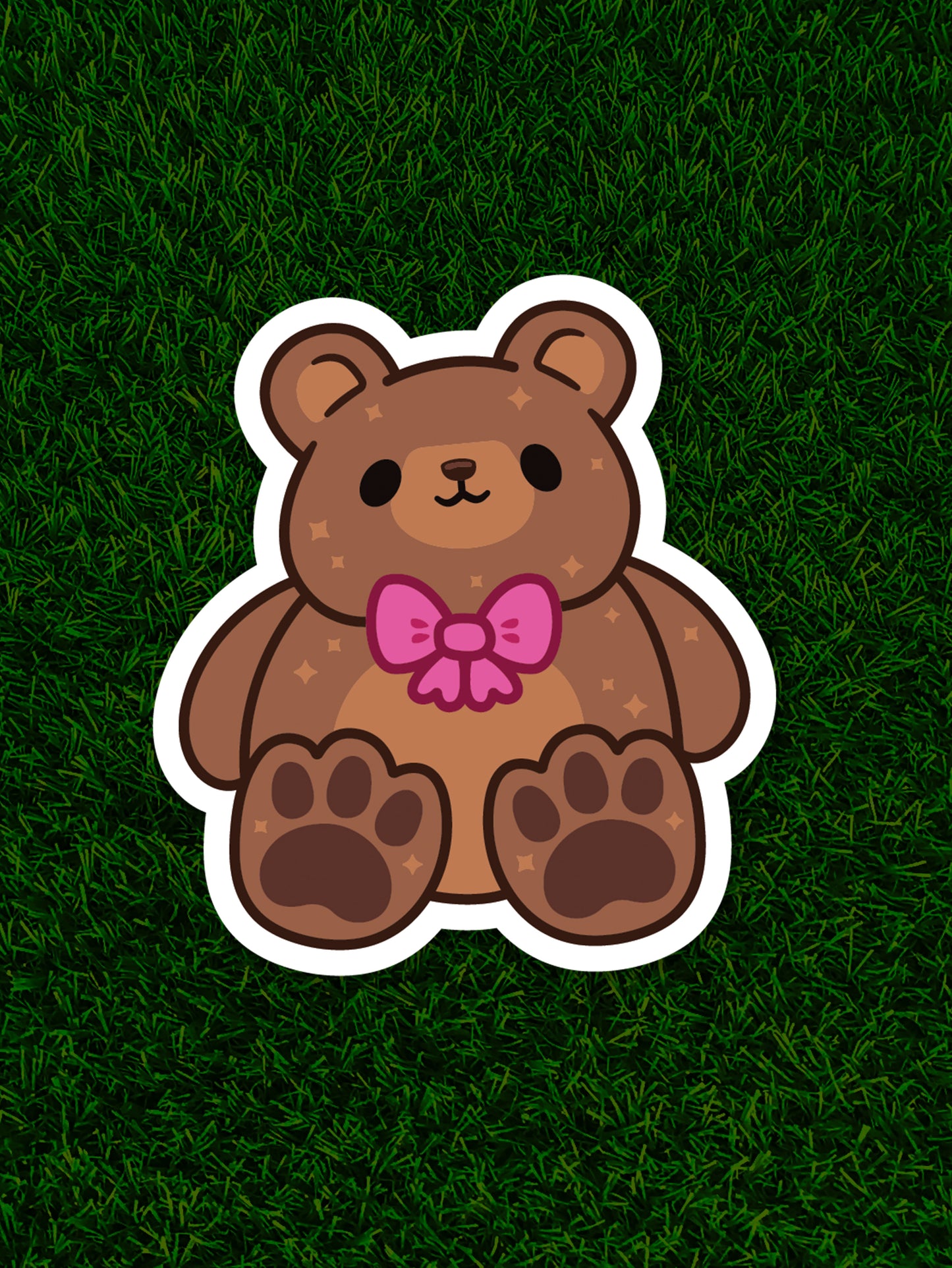 Cartoon bear with a pink bow on a grassy background